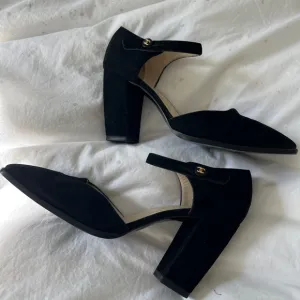 Authentic Chanel suede heels with strap.