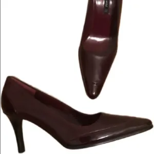 Bruno Magli NWOT deep wine/oxblood pumps.