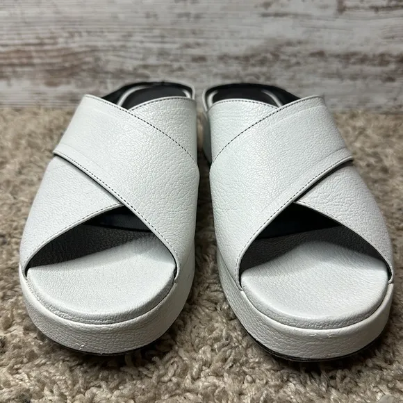 By Far Iggy Mules cross-front platform sandals in white leather