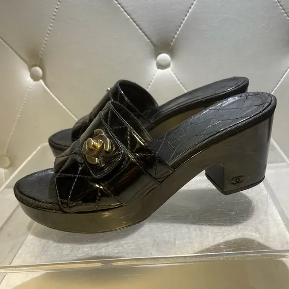 CHANEL tumlock CC logo black gold hardware quilted leather mules plaform