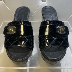 CHANEL tumlock CC logo black gold hardware quilted leather mules plaform