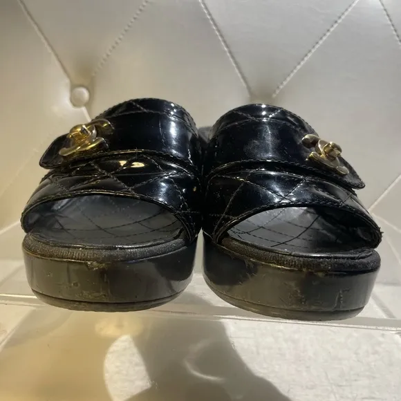 CHANEL tumlock CC logo black gold hardware quilted leather mules plaform