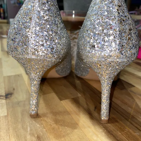 Gently used Kate Spade Marabou Pumps silver and gold glitter with pink feathers