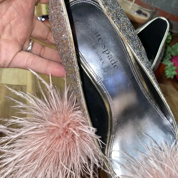 Gently used Kate Spade Marabou Pumps silver and gold glitter with pink feathers