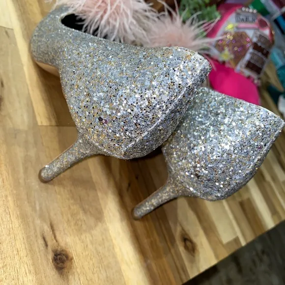 Gently used Kate Spade Marabou Pumps silver and gold glitter with pink feathers