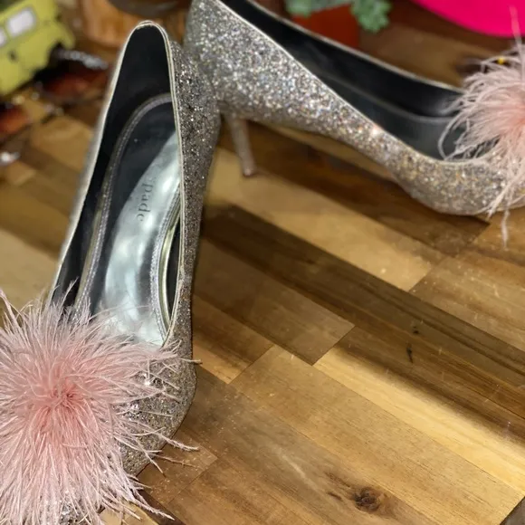 Gently used Kate Spade Marabou Pumps silver and gold glitter with pink feathers