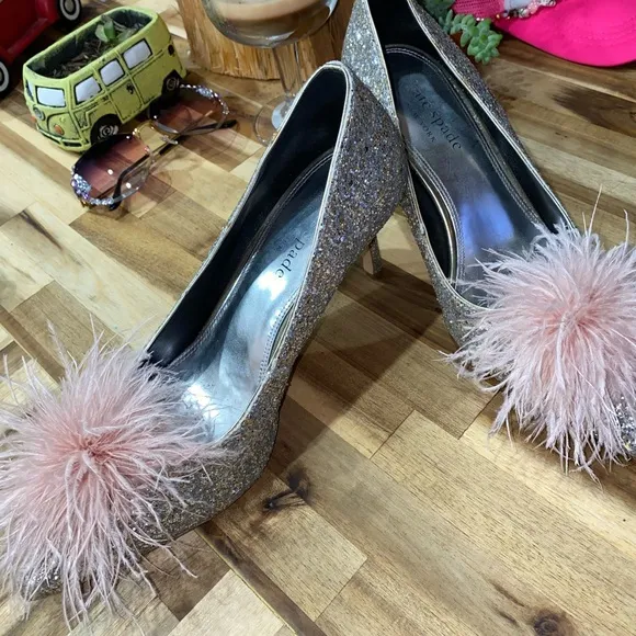 Gently used Kate Spade Marabou Pumps silver and gold glitter with pink feathers