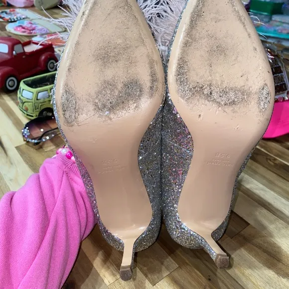 Gently used Kate Spade Marabou Pumps silver and gold glitter with pink feathers