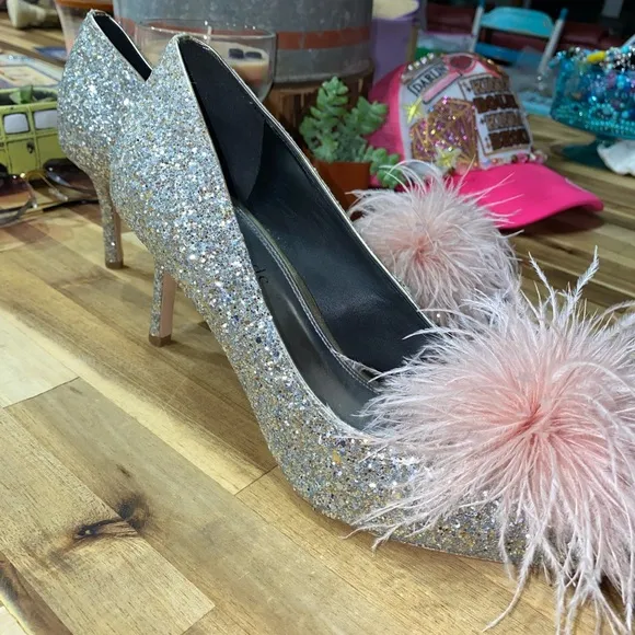 Gently used Kate Spade Marabou Pumps silver and gold glitter with pink feathers
