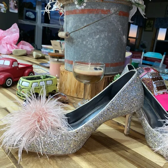 Gently used Kate Spade Marabou Pumps silver and gold glitter with pink feathers