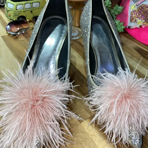 Gently used Kate Spade Marabou Pumps silver and gold glitter with pink feathers