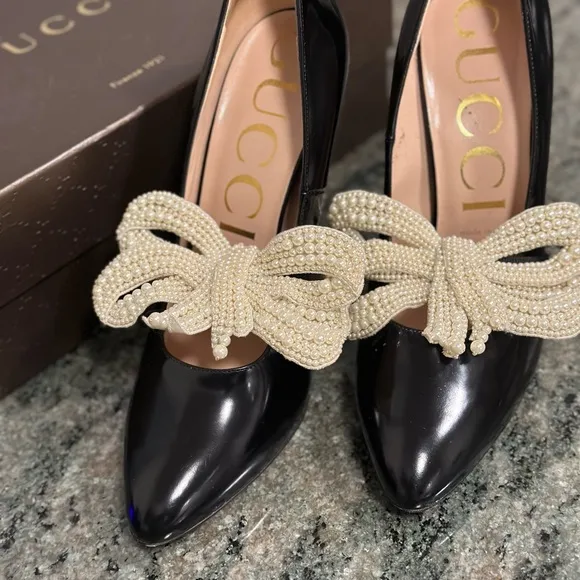 Gucci pumps with removable pearl embellishment.