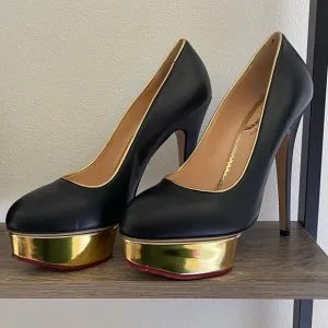 New Charlotte Olympia black and gold platform pumps