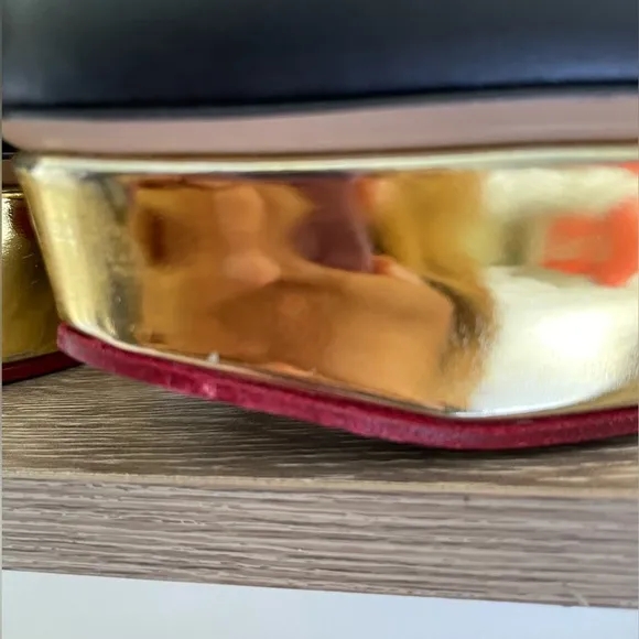 New Charlotte Olympia black and gold platform pumps