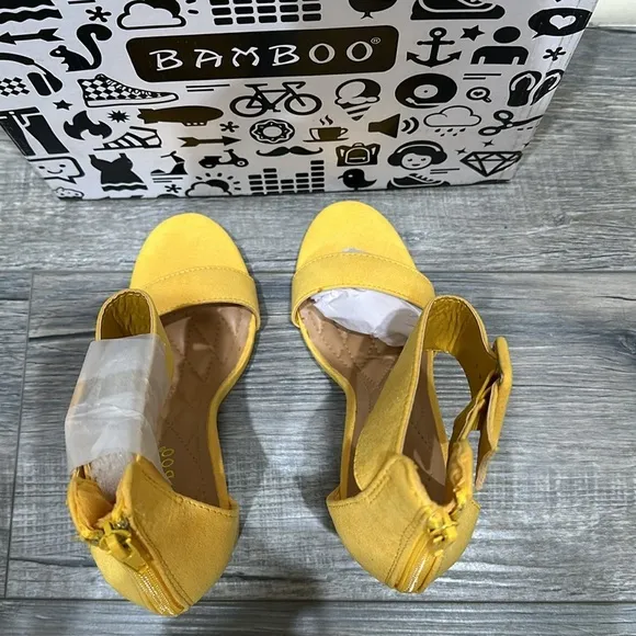 NWT Bamboo yellow sandals. Zips in back. Heel is 4”.