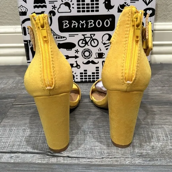NWT Bamboo yellow sandals. Zips in back. Heel is 4”.
