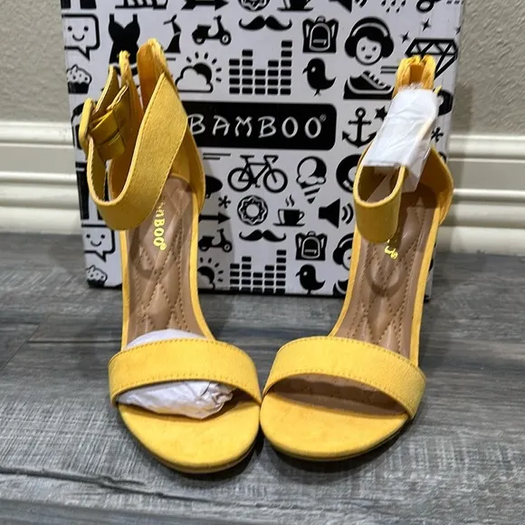 NWT Bamboo yellow sandals. Zips in back. Heel is 4”.