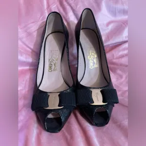 Salvatore Ferragamo Gilia Pebble Heel Color: Black/Gold 7.5