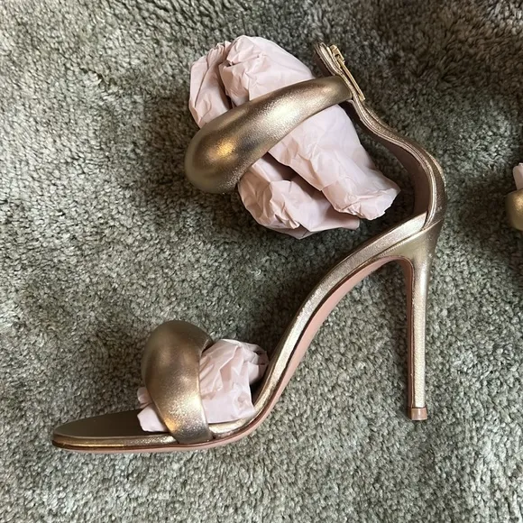 Women’s size 7 BIJOUX metallic gold heels one heel does have some blemish on it.